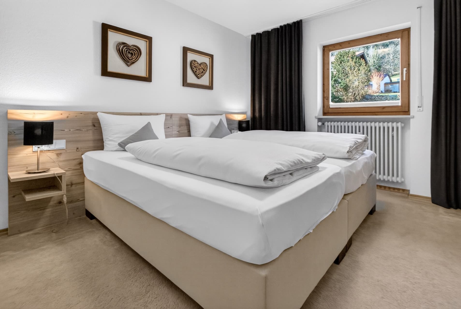 Schlafzimmer Ferienwohnung Bolsterlang – Doppelbett